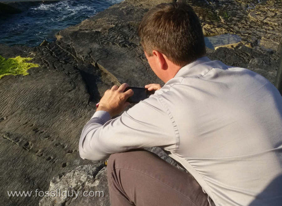 Taking a photo of the tetrapod trackway on Valentia island, Ireland